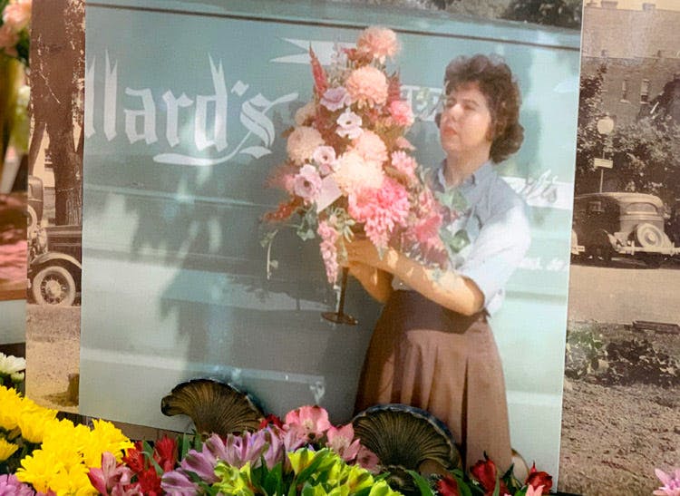 A classic portrait of a floral designer which is still on-display in our Jefferson City location